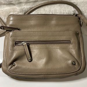 Beige - approx. 8 by 7 inch - lots of pockets and card slots - 52 inch strap.
